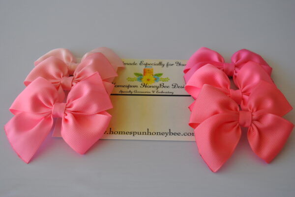 set of 6 pretty Shelby style bow clips in a range of pink hues from light to dark by homespun honeybee designs
