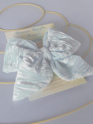 left side angle shot of handmade velvet bow
