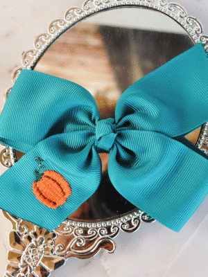 handmade large pumpkin bow on teal ribbon