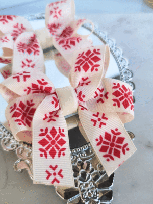 pretty ivory cottagecore Christmas bows with vintage red snowflakes