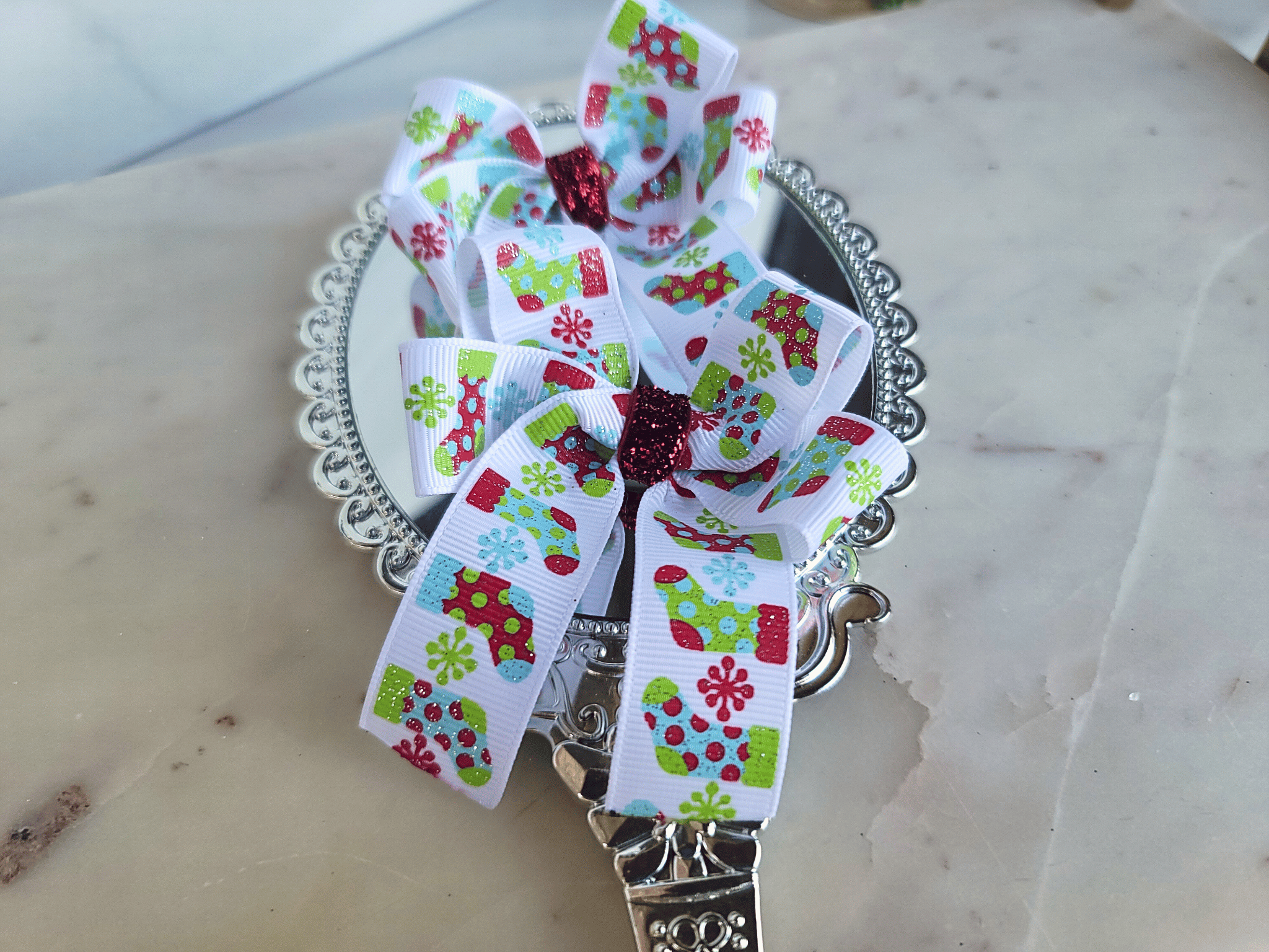 Pigtail Ribbons - White with Green and Red Stockings 1 pigtail bows with Christmas ribbon featuring red and green stockings